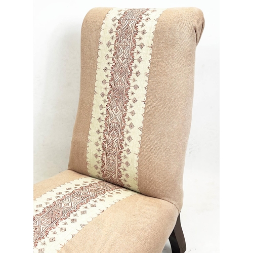 116 - SLIPPER CHAIR, 86cm H x 54cm, Victorian in pink patterned upholstery on castors.