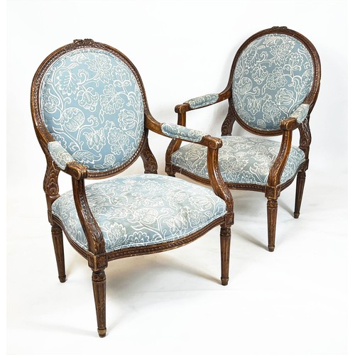 181 - FAUTEUILS, 103cm H x 66cm, a pair, late 19th/early 20th century French beechwood in patterned blue f... 