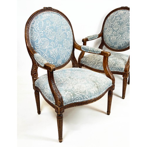 181 - FAUTEUILS, 103cm H x 66cm, a pair, late 19th/early 20th century French beechwood in patterned blue f... 