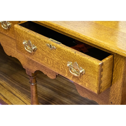 185 - TITCHMARSH AND GOODWIN DRESSER BASE, 77cm H x 167cm x 45cm, Georgian style oak with three drawers.