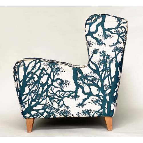 475 - WINGBACK ARMCHAIR, blue and cream 'tree' print upholstery, with tapering beech supports, 77cm W.