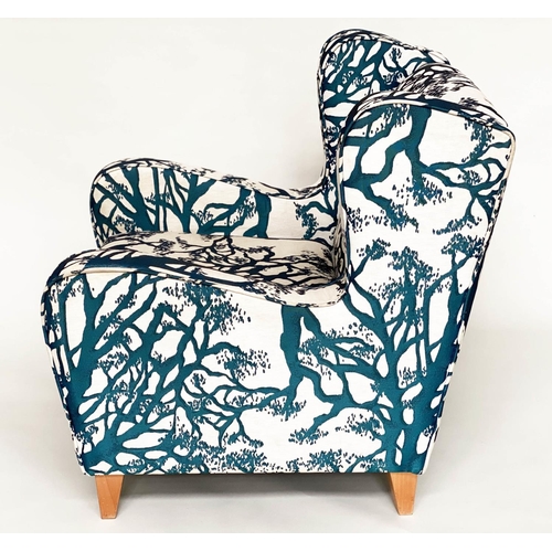 475 - WINGBACK ARMCHAIR, blue and cream 'tree' print upholstery, with tapering beech supports, 77cm W.