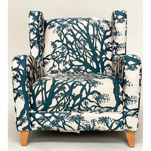 475 - WINGBACK ARMCHAIR, blue and cream 'tree' print upholstery, with tapering beech supports, 77cm W.