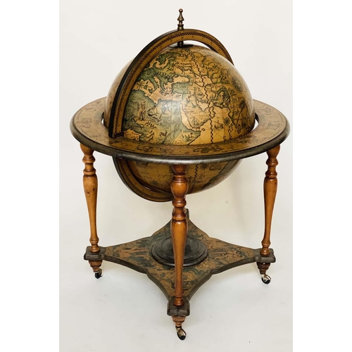 464 - GLOBE COCKTAIL CABINET, in the form of an antique, terrestrial globe on stand with rising 'lid' and ... 