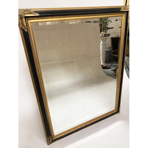 471 - WALL MIRROR, Italian style rectangular ebonised with bevelled mirror, gilt slip and gilt corners, 14... 