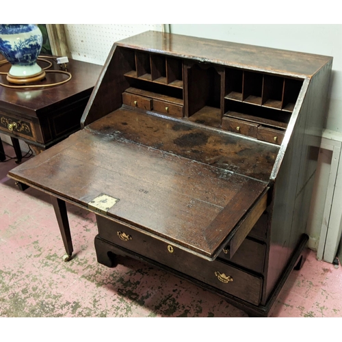 131 - BUREAU, George II, oak, circa 1750, the fall front opening to reveal fitted interior, over four long... 