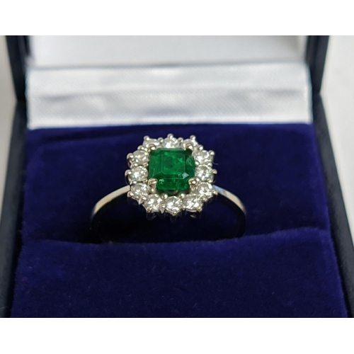 2 - AN EMERALD AND DIAMOND SET DRESS RING, white metal shank, probably 18ct white gold, the central emer... 