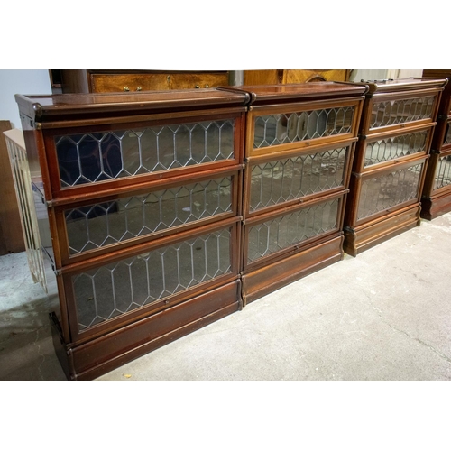 221 - GLOBE WERNICKE BOOKCASES, three matching, circa 1900 mahogany, each in sections with three leaded gl... 