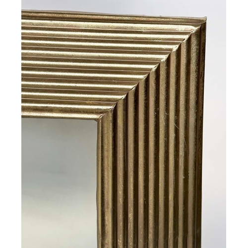 286 - WALL MIRROR, rectangular gilt metal reeded cushion form, 77cm x 77cm.