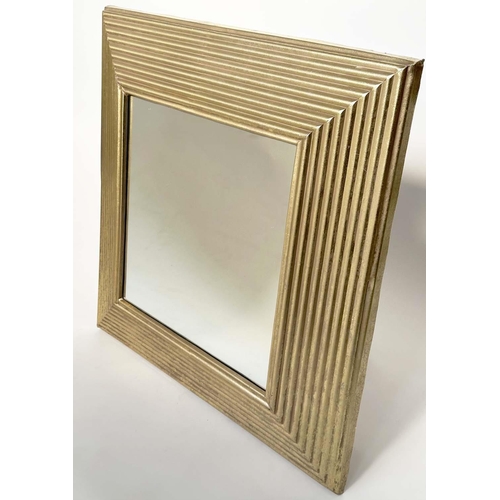 286 - WALL MIRROR, rectangular gilt metal reeded cushion form, 77cm x 77cm.