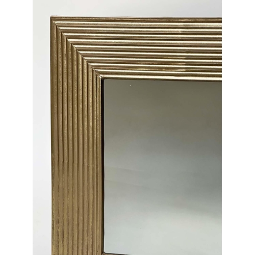 286 - WALL MIRROR, rectangular gilt metal reeded cushion form, 77cm x 77cm.