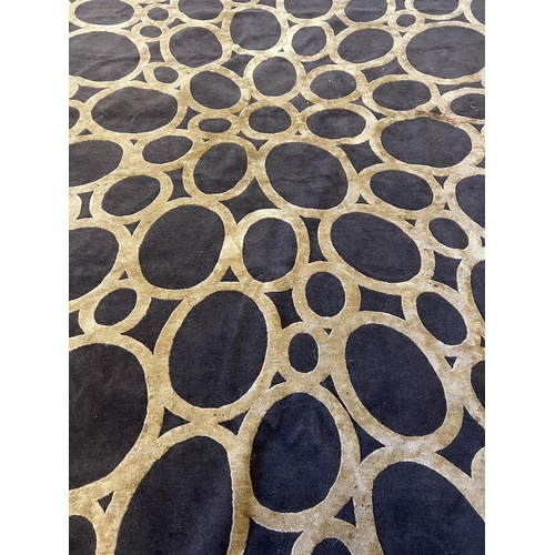 439 - THE RUG COMPANY CARPET, 368cm x 275cm, 'Gold Rings' designed by David Rockwell.