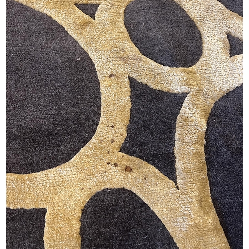 439 - THE RUG COMPANY CARPET, 368cm x 275cm, 'Gold Rings' designed by David Rockwell.