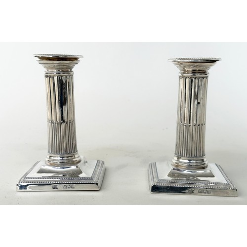 142 - CANDLESTICKS BY MAPPIN AND WEBB, a pair, silver stop fluted columns and square bases 1899, London, M... 