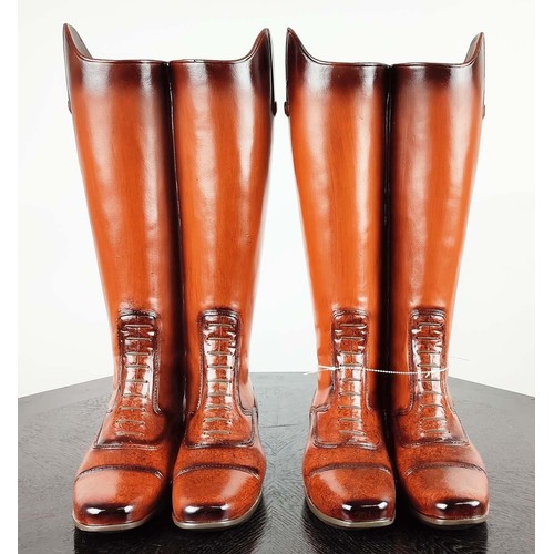 398 - STICK STANDS, a pair, faux riding boots design, painted resin, 48cm H each. (2)