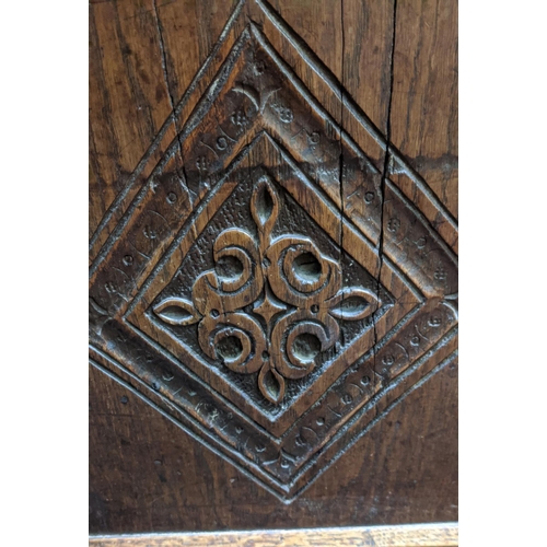 115 - COFFER, 132cm W x 46cm D x 58cm H, Charles II oak with a rising lid and three carved front panels.