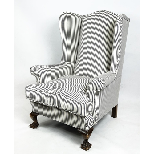 214 - WING ARMCHAIR, 107cm H x 79cm, Georgian style in new ticking upholstery.