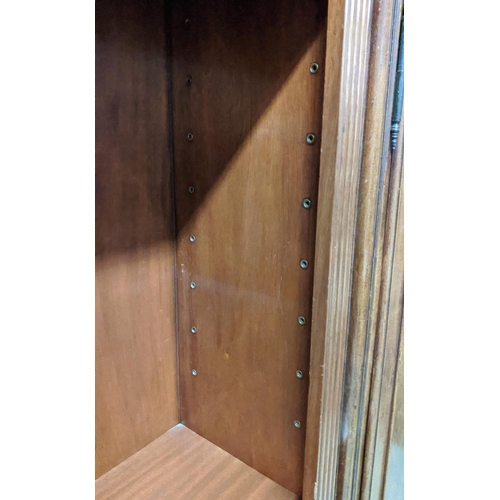 186 - ARTHUR BRETT MODEL2284 BOOKCASES, a pair, each 84cm H x 90cm W x 35cm D, mahogany with fluting and b... 