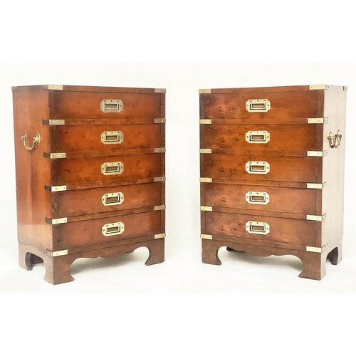 314 - CAMPAIGN STYLE CHESTS, 66cm H x 46cm W x 29cm D, a pair, yewwood and brass bound each with five draw... 