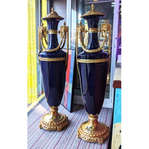 361 - FLOOR STANDING URNS, a pair, Sevres style, blue ceramic with gilt metal mounts, 135cm H each. (2)