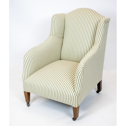 177 - ARMCHAIR, 88cm H x 61cm W, Edwardian in new green ticking on steel castors.