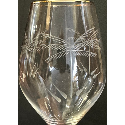 146 - PALM TREE DRINKING GLASSES, a set of twelve, tall etched and gilded, 26 H. (12)