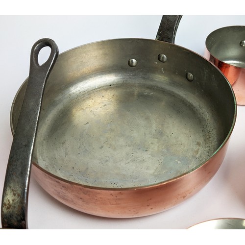 162 - BATTERIE DE CUISINE, comprising of a graduated set of five copper pans, the largest 20cm diam, anoth... 