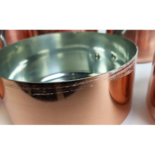 162 - BATTERIE DE CUISINE, comprising of a graduated set of five copper pans, the largest 20cm diam, anoth... 