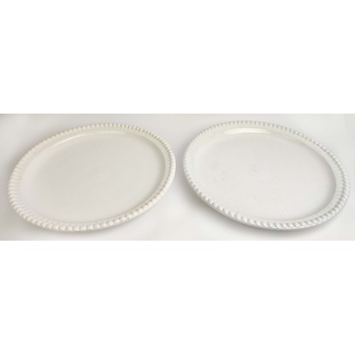 8 - CERAMIC PLATES, a near pair, in a clear glaze, with a beaded  border, 50cm D. (2)