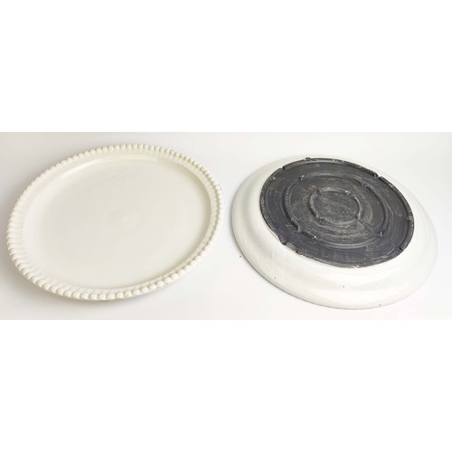 8 - CERAMIC PLATES, a near pair, in a clear glaze, with a beaded  border, 50cm D. (2)