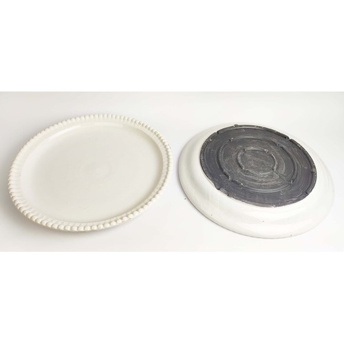 8 - CERAMIC PLATES, a near pair, in a clear glaze, with a beaded  border, 50cm D. (2)