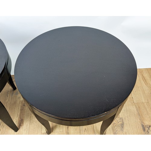 359 - SIDE TABLES, a pair, ebonised, each with a circular top, 60cm diam x 52cm H. (2)