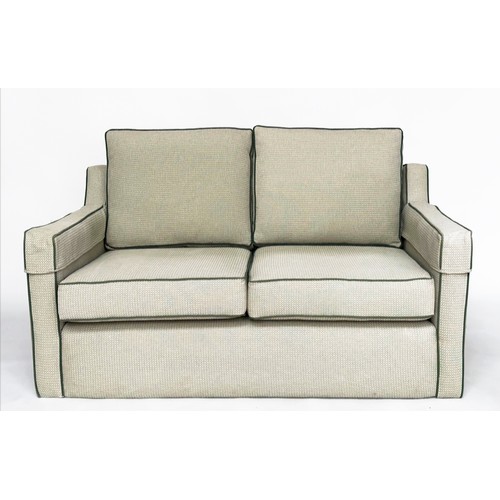 486 - SOFA, two seater, Classical form in green piped woven linen, 1450cm W.