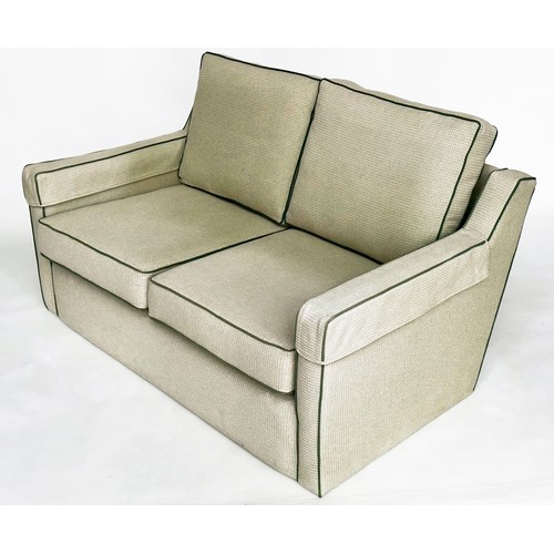 486 - SOFA, two seater, Classical form in green piped woven linen, 1450cm W.