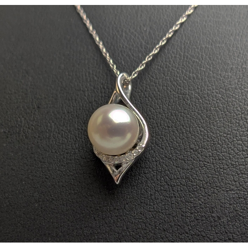 53 - A 9CT WHITE GOLD AND PEARL AND DIAMOND PENDANT NECKLACE, with a single row of diamonds below the pea... 