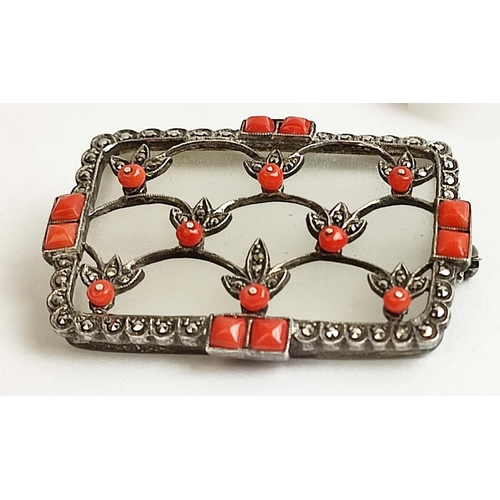 11 - A THEODOR FAHRNER ART DECO SILVER MARCASITE BROOCH, rock crystal plaque,with coral cabouchons and ap... 