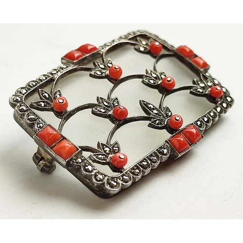 11 - A THEODOR FAHRNER ART DECO SILVER MARCASITE BROOCH, rock crystal plaque,with coral cabouchons and ap... 