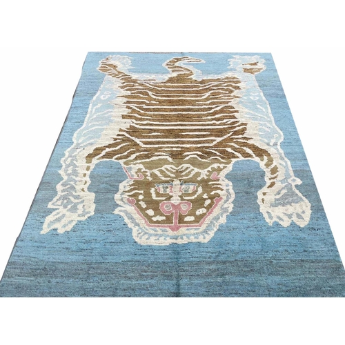 172 - FINE TIBETAN TIGER CARPET, 285cm x 202cm.