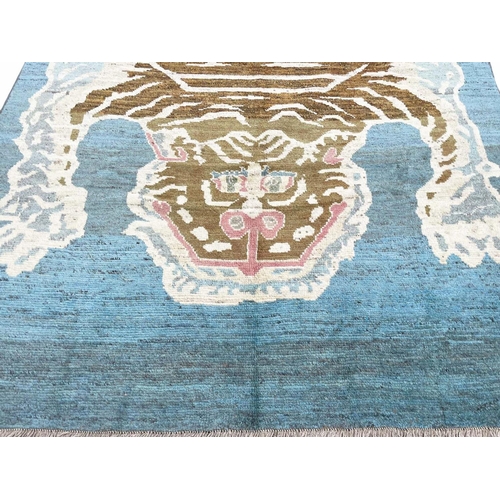 172 - FINE TIBETAN TIGER CARPET, 285cm x 202cm.