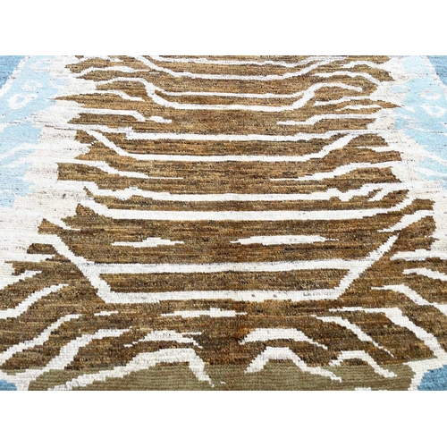 172 - FINE TIBETAN TIGER CARPET, 285cm x 202cm.