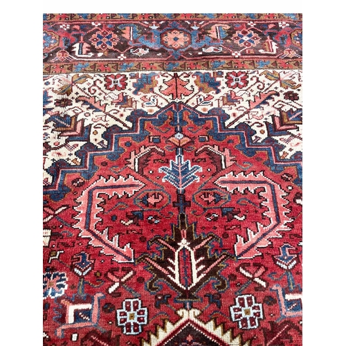 179 - PERSIAN HERIZ CARPET, 333cm x 268cm.