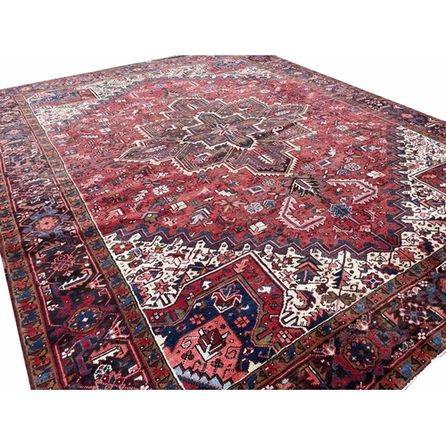 179 - PERSIAN HERIZ CARPET, 333cm x 268cm.