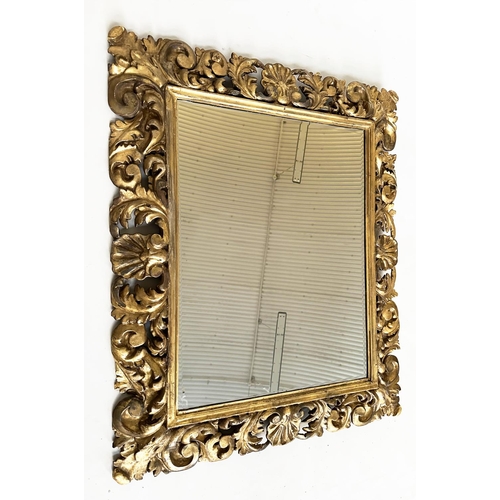 216 - FLORENTINE WALL MIRROR, 19th century Italian Florentine carved giltwood cushion pierced frame and be... 