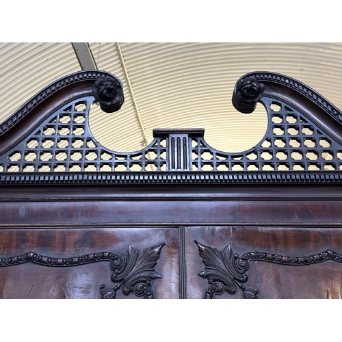 228 - LINEN PRESS, 18th century George III figured mahogany with swan neck cornice, carved panelled doors ... 