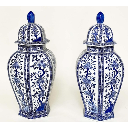 239 - TEMPLE JARS, a pair, Chinese blue and white ceramic facetted with lids, 50cm H. (2)