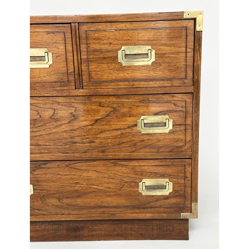 252 - LOW CHEST, campaign style elm and brass bound with seven drawers, 143cm x 46cm x 73cm H.