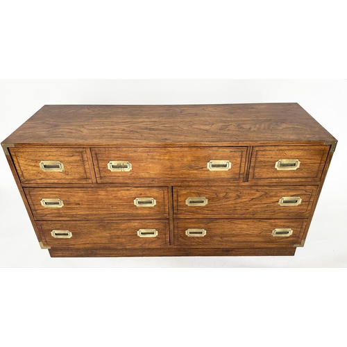 252 - LOW CHEST, campaign style elm and brass bound with seven drawers, 143cm x 46cm x 73cm H.