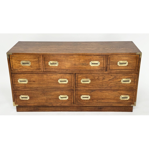 252 - LOW CHEST, campaign style elm and brass bound with seven drawers, 143cm x 46cm x 73cm H.