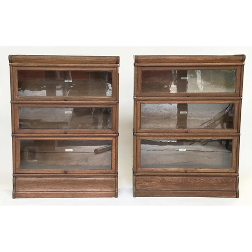 258 - GLOBE WERNICKE BOOKCASES, a pair, early 20th century oak each with three glazed stacking sections, a... 