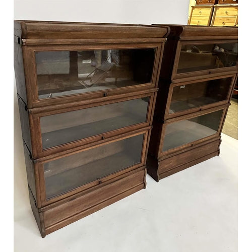 258 - GLOBE WERNICKE BOOKCASES, a pair, early 20th century oak each with three glazed stacking sections, a... 